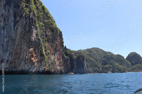 boat ride on the sea, exotic James Bond islands against the blue sea, waves of spray in Thailand