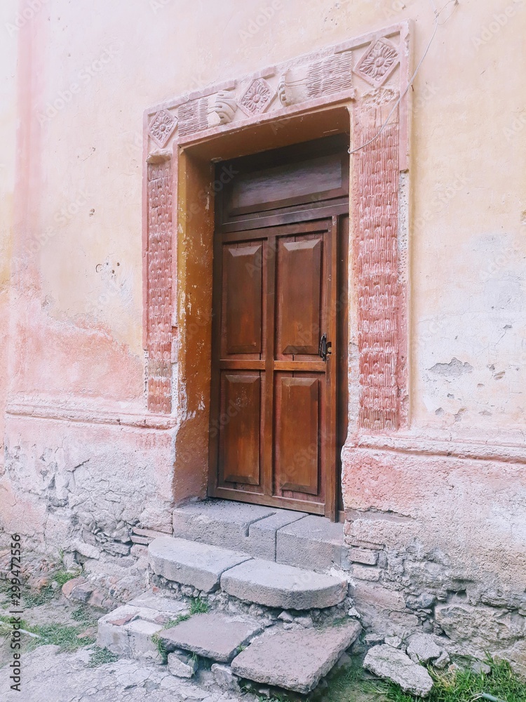 Fototapeta premium old door in brick wall