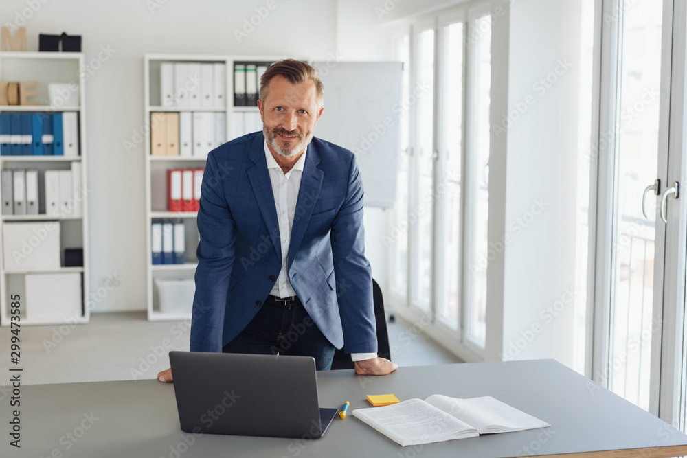 Smiling smart professional businessman in office Smiling smart professional businessman in office