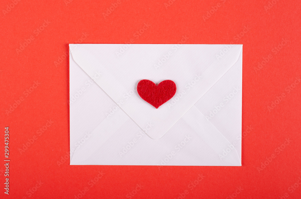 Paper envelope with red heart composition on red background. Paper envelope with red heart composition on red background.