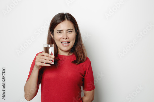 Pretty woman drinking water from glass