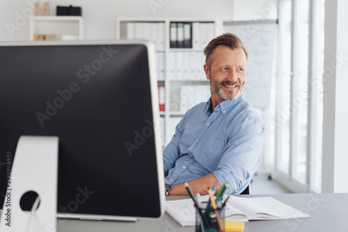 Photography Relaxed businessman watching in amusement