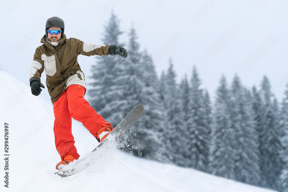 Snowboarder on snow hill. Mountain freeride snowboarding. Winter Carpathians