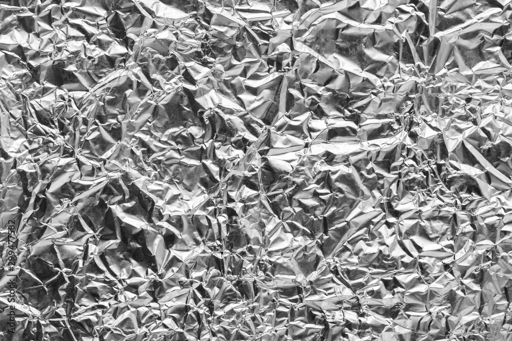 Silver Leaf Foil Background with Shiny Crumpled Uneven Surface for