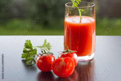 Tomato juice with parsley. Selective focus.