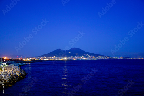 A night view of the Neapolitan Bay and Volcano Vesuvius, Naples, Italy.