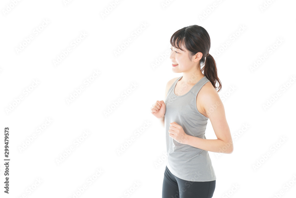 ランニングをする若い女性