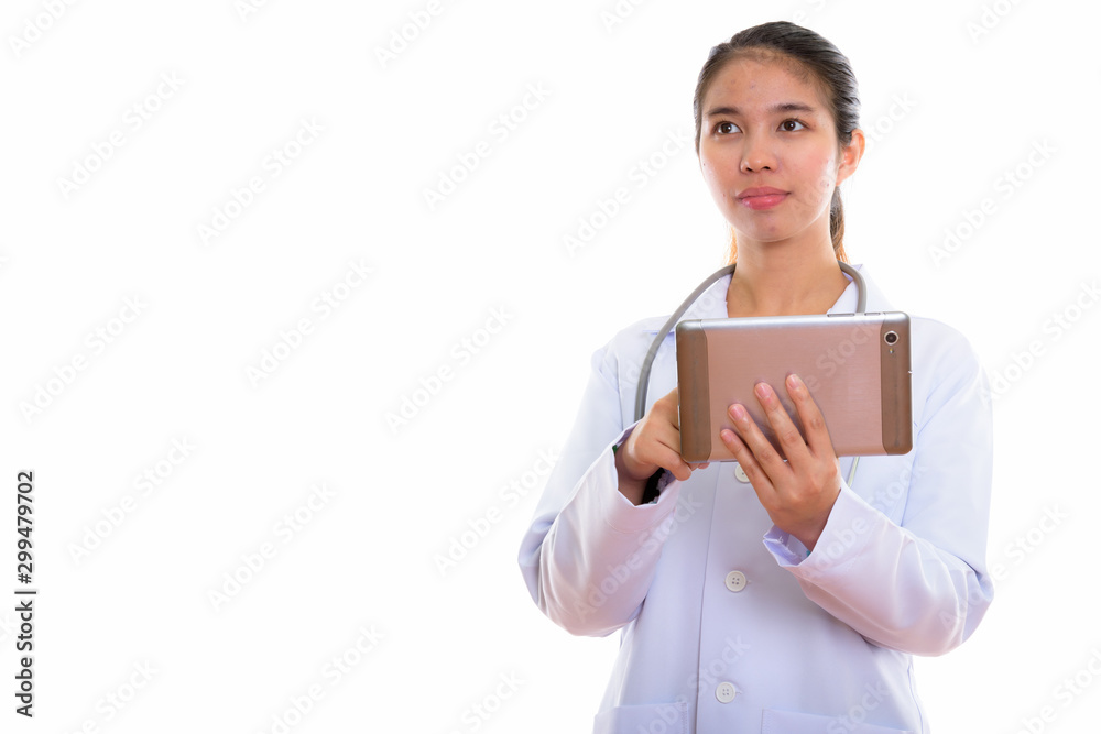 Portrait of young Asian woman doctor using digital tablet Portrait of young Asian woman doctor using digital tablet