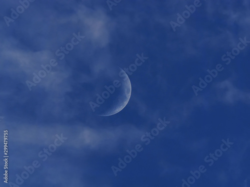 moon on the blue sky. the clouds