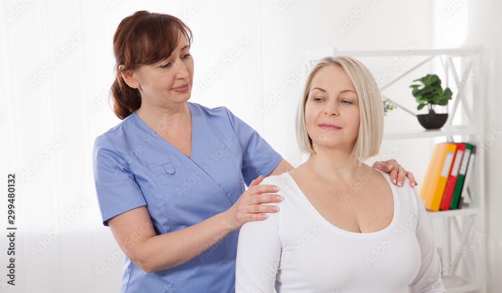 Picture of middle aged woman during rehabilitation in professional clinic