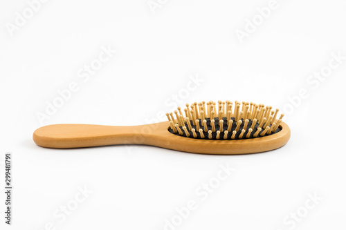 Wooden hair brush isolated on white background wood comb for hair care