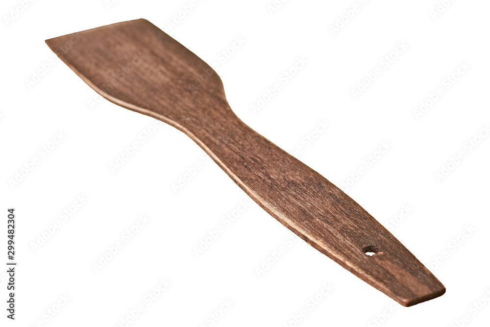 Single old scratched wooden spatula of brown color isolated on white background without shadow. Close-up
