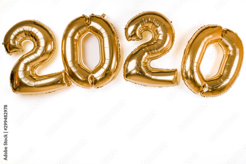 golden 2020 new year balloons isolated over white wall golden 2020 new year balloons isolated over white wall