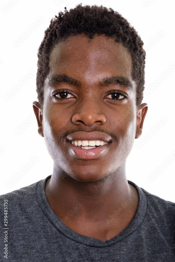 Studio shot of young African teenage boy with Afro hair Studio shot of young African teenage boy with Afro hair