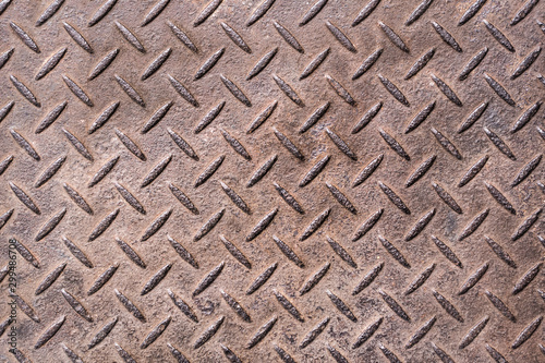 Worn Diamond Plate background, worn rusted patina, industrial work surface. photo