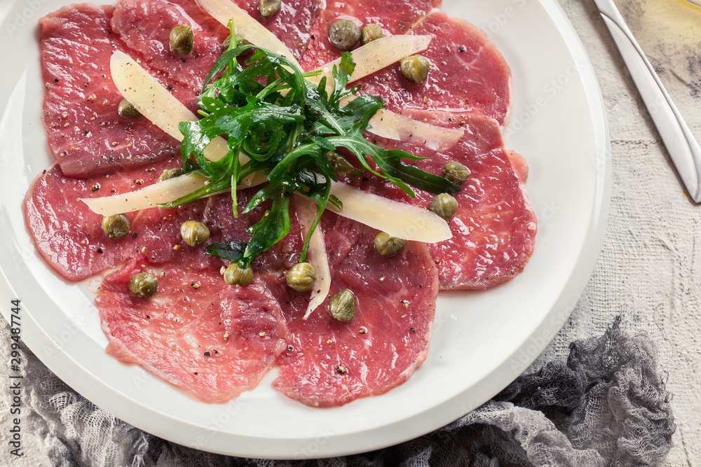 Beef carpaccio with arugula and parmesan