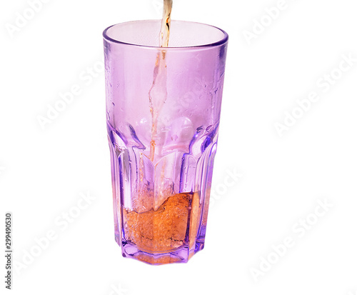 welcome soft drink pours into the glass photo