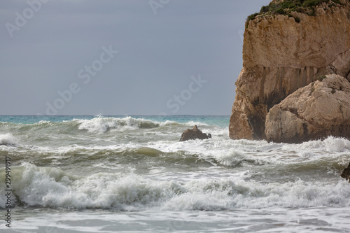 Wave splashes against Aphrodite's Rock, Cyprus.