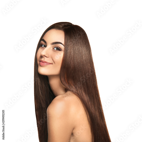 Portrait of beautiful young woman with healthy long hair on white background