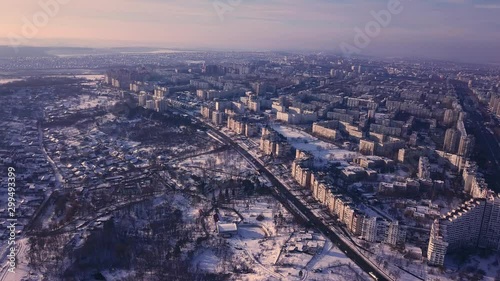 Top view of city in winter at sunset on sky background. Aerial drone videography concept. 4K. Kishinev, Republic of Moldova. photo