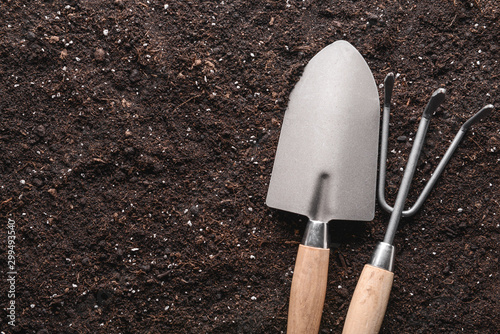 Gardening tools on soil, to...