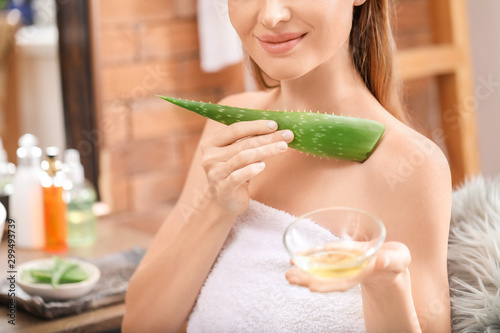 Beautiful young woman using...