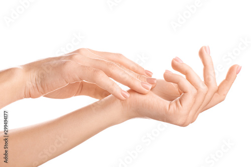 Hands of beautiful young woman on white background