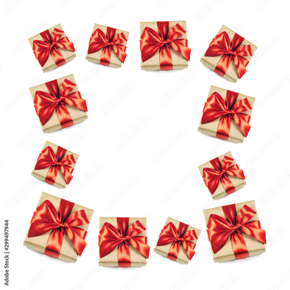 Frame of festive gift boxes with red ribbon bow isolated on white background.