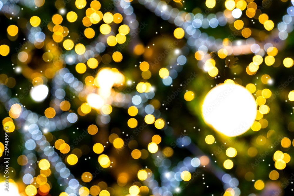 Colorful orange bokeh with snow background of Christmas lights and New year