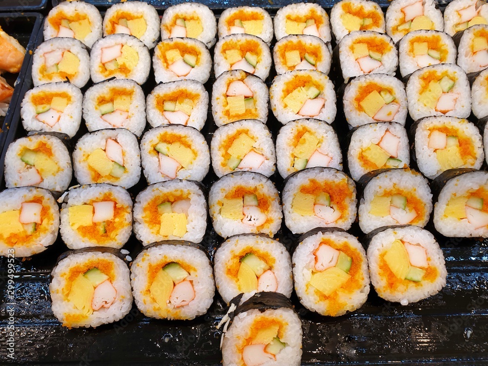 Japanese food style, Top view of california roll maki sushi with crab meat, mayonnaise, cucumber, beluga caviar and sweet omelette as a background in restaurant, Ready to eat or serve Japanese food style, Top view of california roll maki sushi with crab meat, mayonnaise, cucumber, beluga caviar and sweet omelette as a background in restaurant, Ready to eat or serve