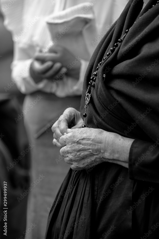 Woman in mourning with a rosary Woman in mourning with a rosary