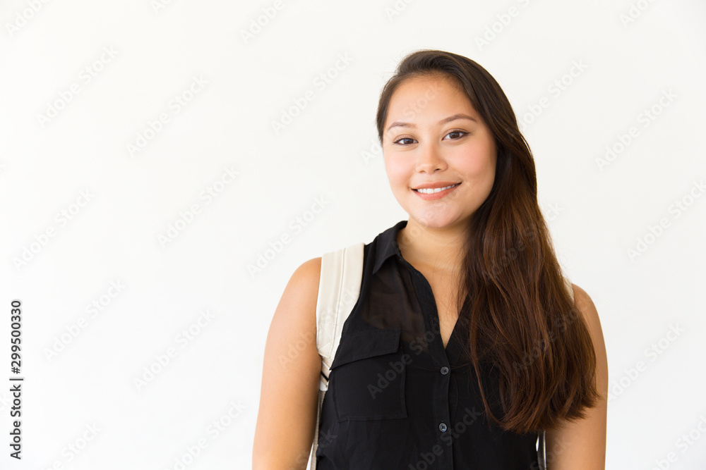 Studio portrait of happy positive student girl in casual with backpack. Young Latin woman standing isolated over white background, looking at camera, smiling. Studio female portrait concept Studio portrait of happy positive student girl in casual with backpack. Young Latin woman standing isolated over white background, looking at camera, smiling. Studio female portrait concept