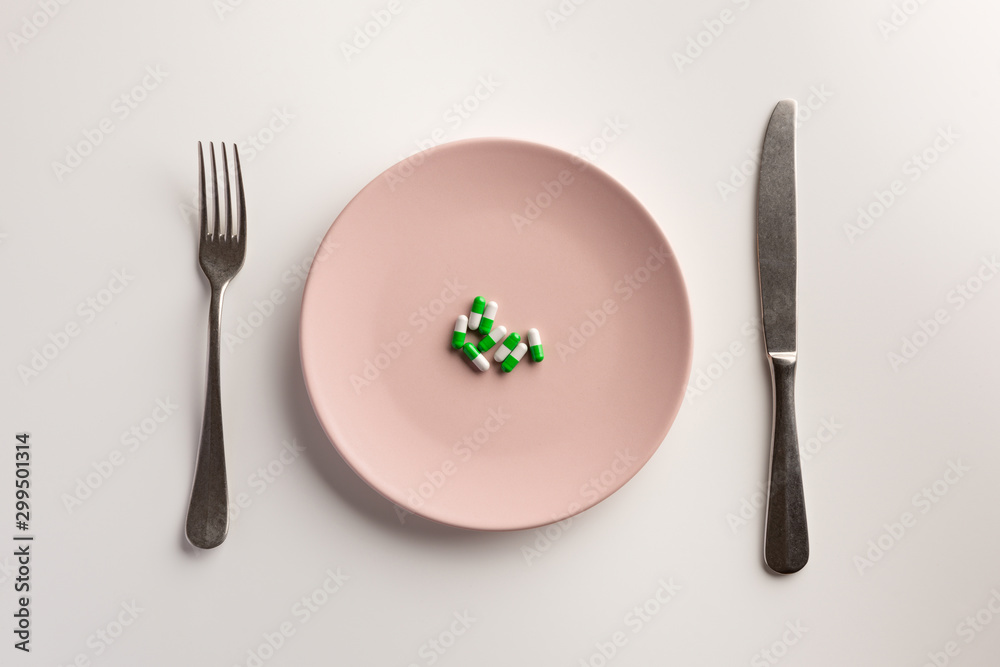 Medical capsules on a plate. Flat lay. Medical capsules on a plate. Flat lay.