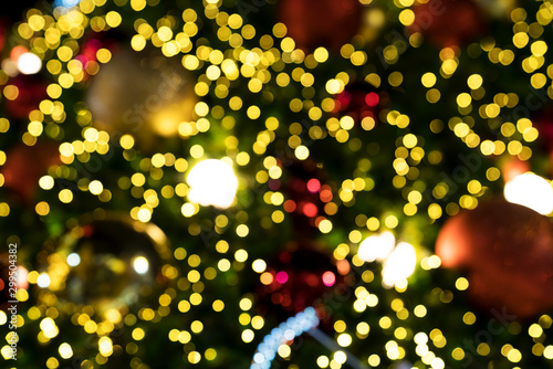 Colorful orange red bokeh background of Christmas lights and New year