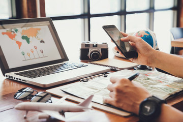 Young man using smartphone planning vacation trip.travel , trip vacation,