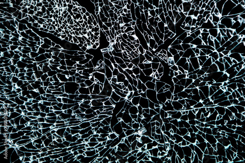 Close-up of Broken Glass, Shattered Tempered glass on Black Background