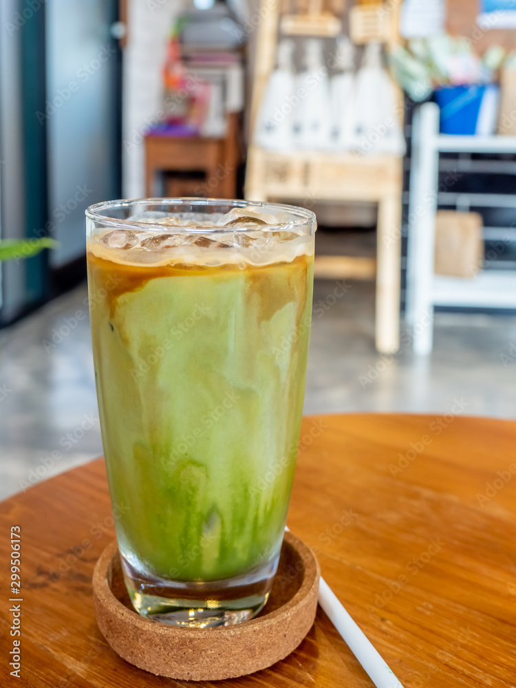 Mixed iced green tea and coffee beverage in glass in coffee shop Mixed iced green tea and coffee beverage in glass in coffee shop