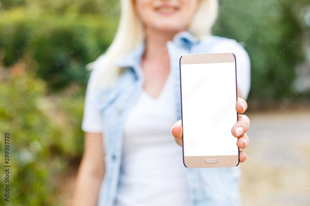 Smiling woman with a smartphone