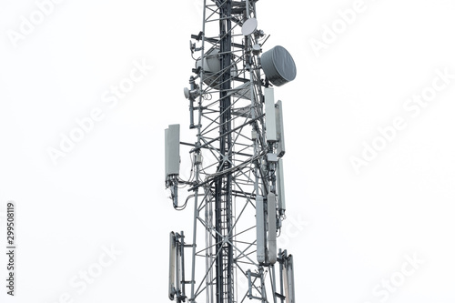 Detailed view of a newly installed 4G and Microwave communications tower. Showing the various antennas and omnidirectional network and phone systems. photo