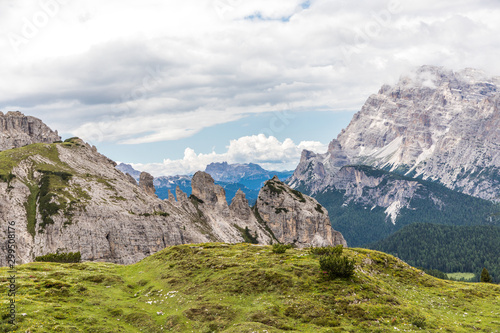 Dolomites, Italy - July, 2019: Drei Zinnen or Tre Cime di Lavaredo with beautiful flowering meadow, Sextener Dolomiten or Dolomiti di Sesto, South Tirol, Dolomiten mountains view, Italian Alps