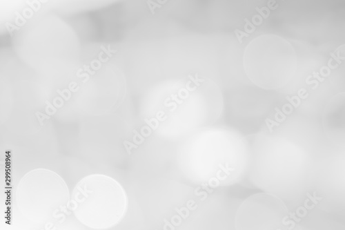 Abstract white bokeh with soft blurred background nature blurry light party in vintage style warm shimmering and faded colorful defocused circular modern. Gray silver shiny copy space for holiday.