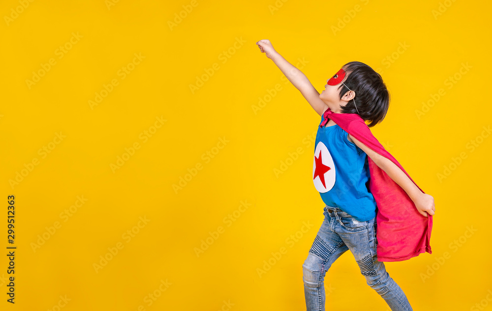 Portrait of asian little boy playing pretend to superhero. Happy young cut boy wearing hero costume, education childhood lifestyle, back to school concept - obrazy, fototapety, plakaty 