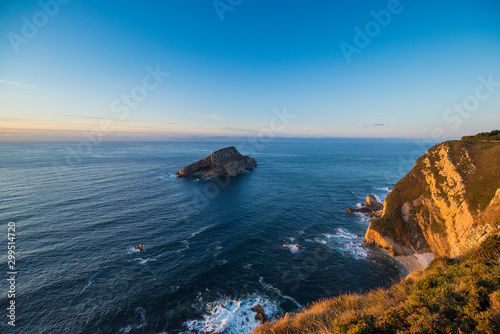 Asturias, sunset on the beach from a cliff in the Cantabrian Sea near Cudilleros. photo