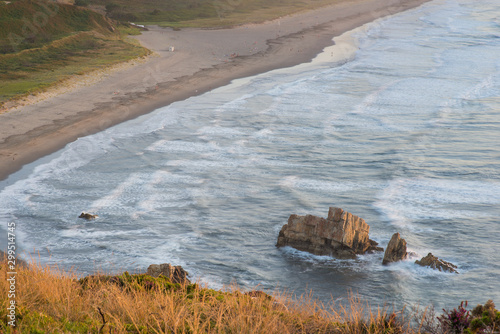 Asturias, sunset on the beach from a cliff in the Cantabrian Sea near Cudilleros. photo