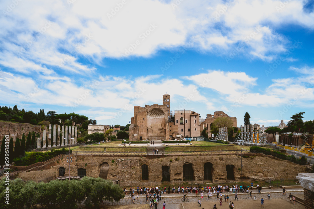 Roman Forum or Foro Romano, Rome, Italy. Antique Roman Forum is one of the main tourist attractions of Rome. Scenery of old ruins in Rome center. Panorama of remains of ancient Roma city in summer.