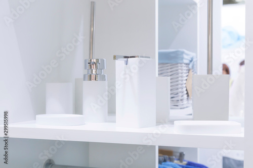 Showcase in a household goods store. Various products for the bathroom on the stand to display the range. Interior details  hygiene products  soap dish  glass  coat rack  home space organization