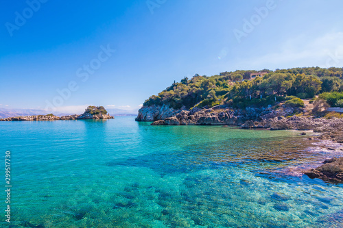 Rocky beach landscape on summer day, Beautiful turquoise color sea water. Corfu, Greece.