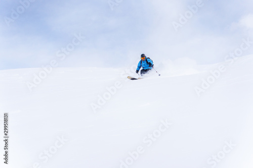 Photo of sport man skiing .