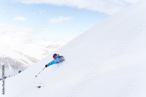 Side photo of sport man with skiing