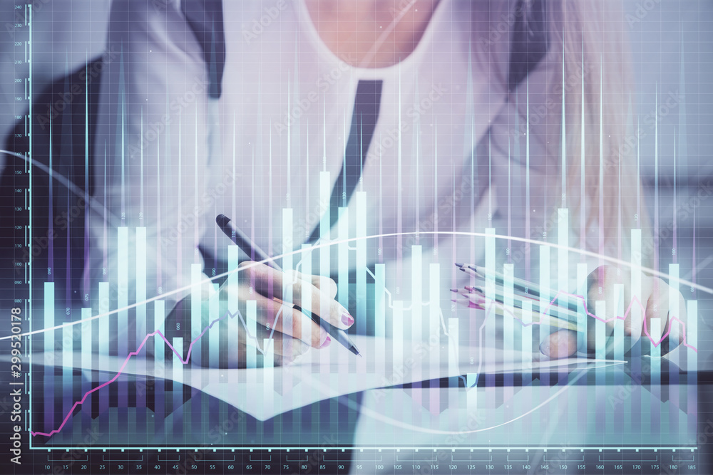 Double exposure of hands making notes with forex chart huds. Stock market concept. Double exposure of hands making notes with forex chart huds. Stock market concept.